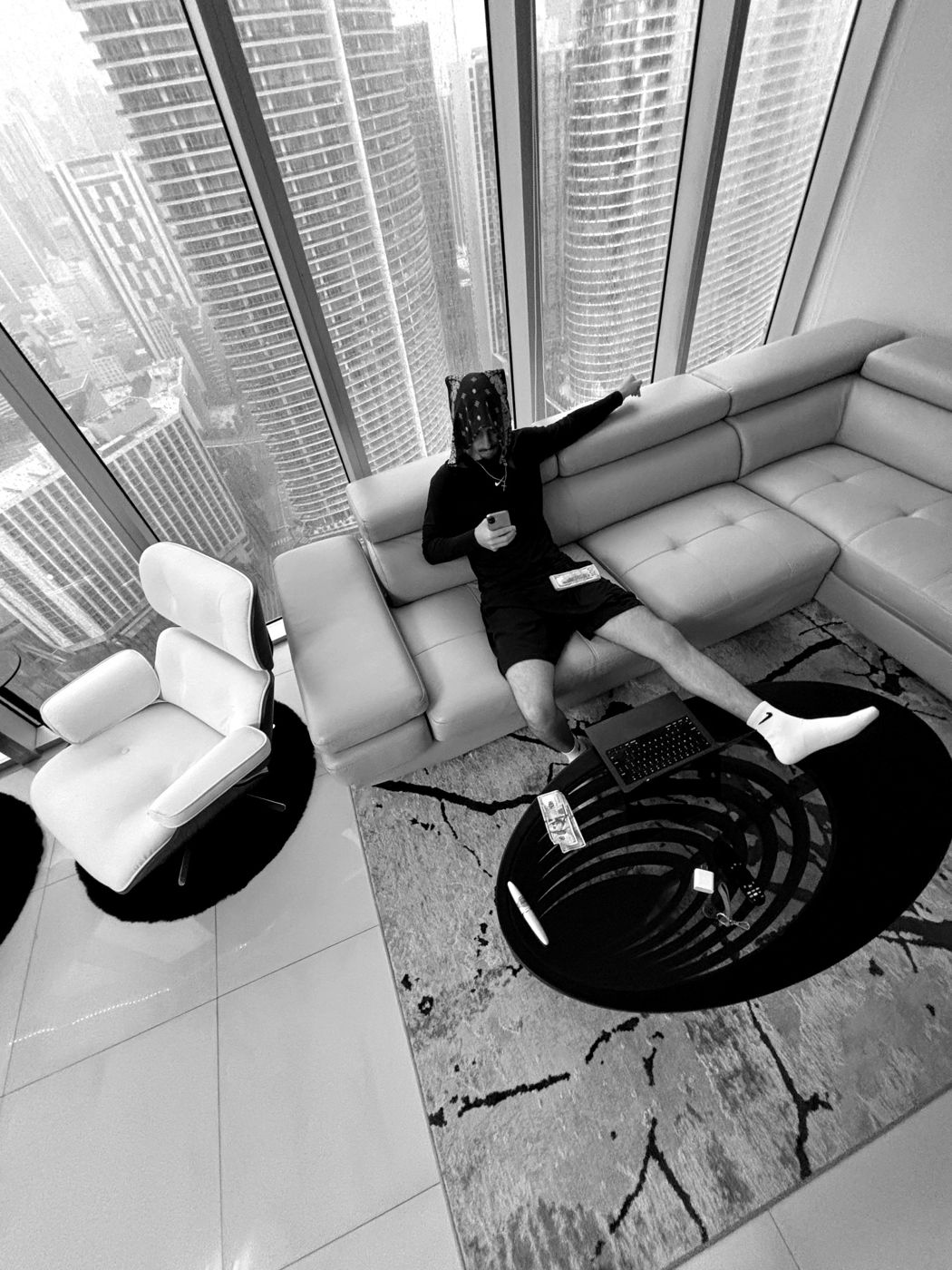 James Wilkins III working from a high-rise apartment overlooking the city